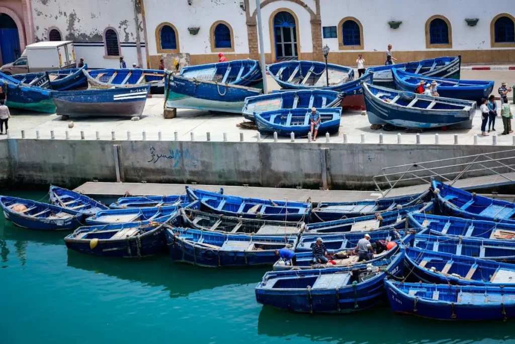Blue fishing boats along the coast of Essaouira Morocco